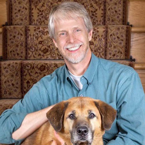 Dr. Lawrence Gallagher with a dog